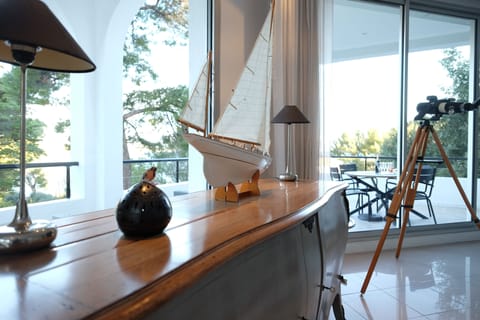 Lounge with wrap around balconies with sea views