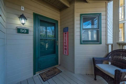 Private entrance with outdoor seating.