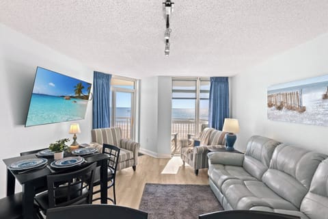 The ocean front living room is well-appointed with comfortable furnishings.