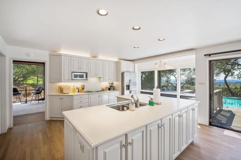 New dishwasher, double oven, and refrigerator along with a full set of pots, pans, and kitchen utensils make preparing meals for large groups easy!