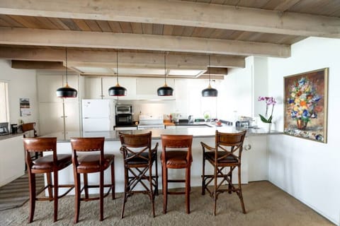 5 or 6 can enjoy chatting with your chef while enjoying the view of the ocean