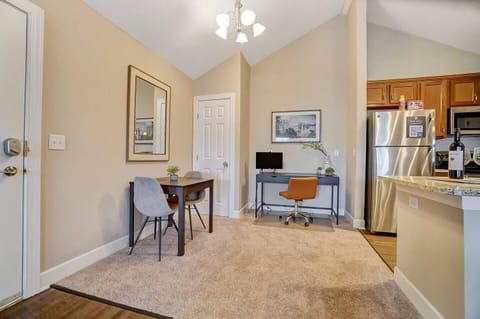 Spacious entry area with breakfast table and office desk area.