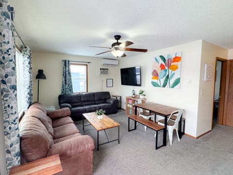 Open living and dining area with lots of natural light! Sleeper sofa in living room, sleeps 6 total