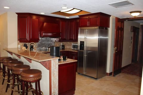 Full kitchen in Suite A with dishes, utensils, pans, coffee maker, microwave 