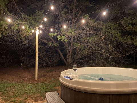 Private hot tub behind the home with new String Lights installed!!
