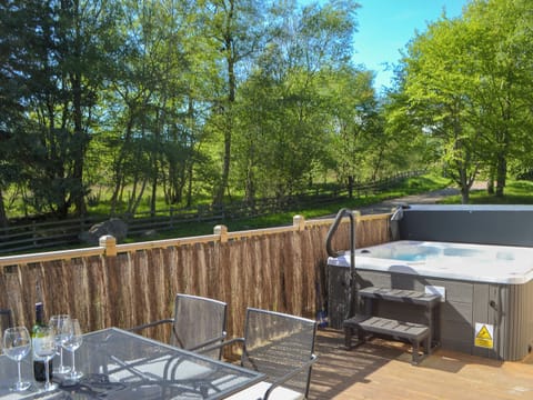 Peacful decking with seating area and private hot tub | Maple Lodge, Otterburn, near Bellingham