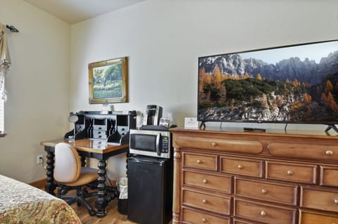 Flat screen TV,  mini refrigerator, microwave,  Keurig,  and desk space perfect for the guest who works during their trip.