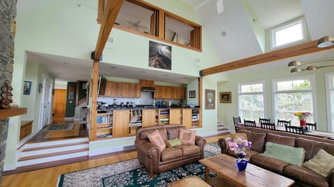 Living room with dining area and open kitchen beyond