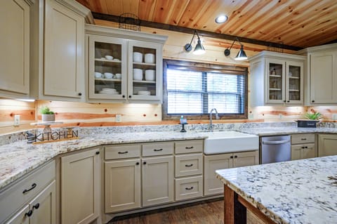 This kitchen is equipped with modern stainless appliances.