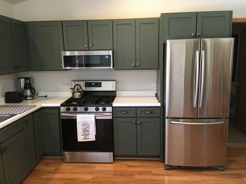 Close up of updated appliances and renovated kitchen