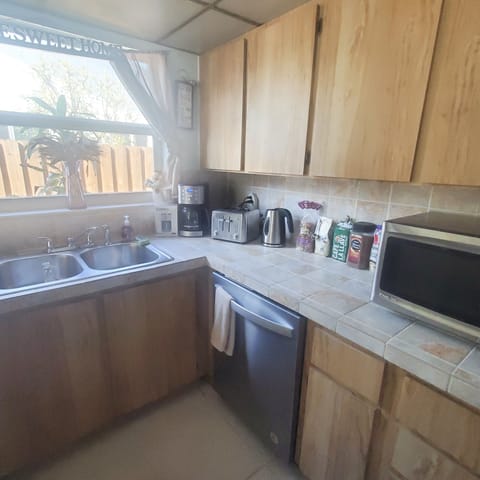 Kitchen have  coffee maker , big toaster, waffles maker , microwave, kettle