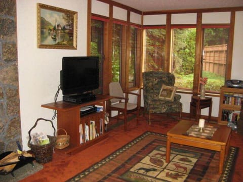 Living Room - Flat screen TV and windows with forest view
