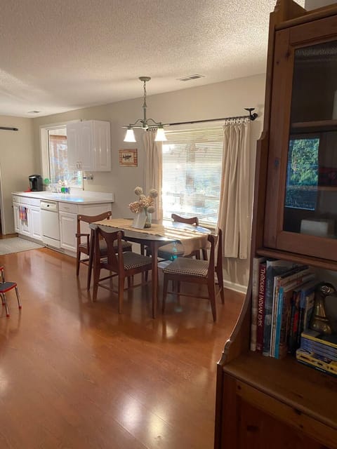 Kitchen and dining offer views of the lake and open to the living area.