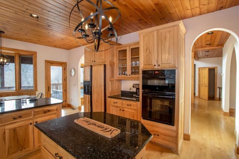 Kitchen with Granite Island, Wall-Mounted Oven and Microwave