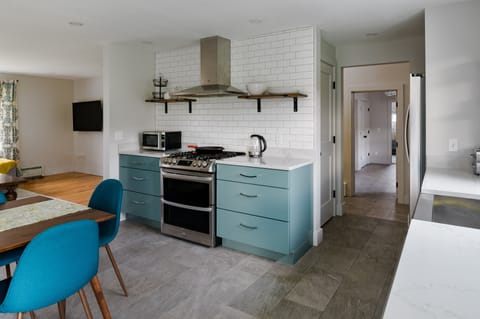A well stocked kitchen with a new LG oven, microwave and electric kettle