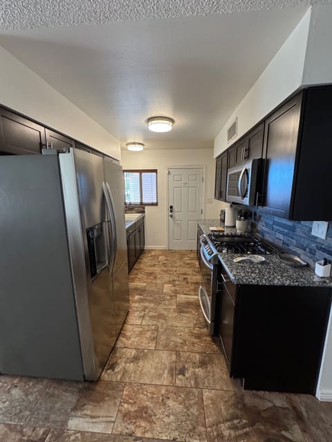 Kitchen with LG Appliances and Granite Countertops