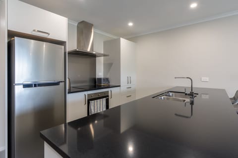 Kitchen stocked with appliances.