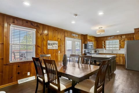 Seating for 6 with more chairs and a leaf stored for larger parties.