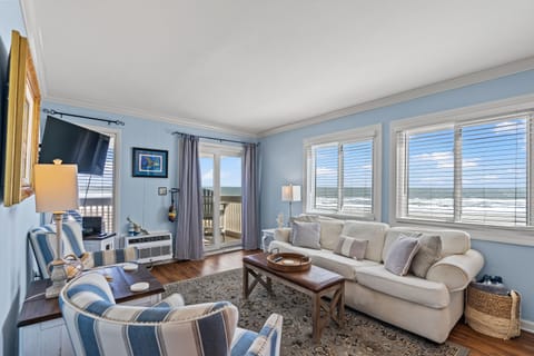 The ocean front living room is well-appointed with comfortable furnishings.