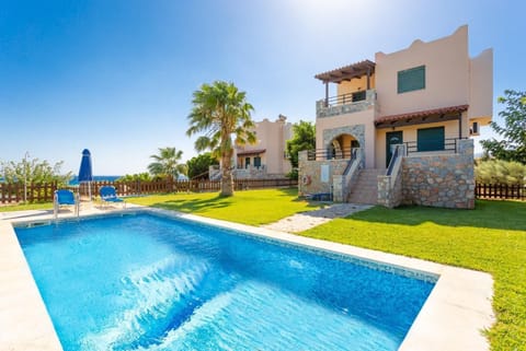 Beautiful villa with private pool, lawn, and terrace with sea views