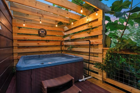 Enjoy relaxing in the hot tub with privacy screened pergola