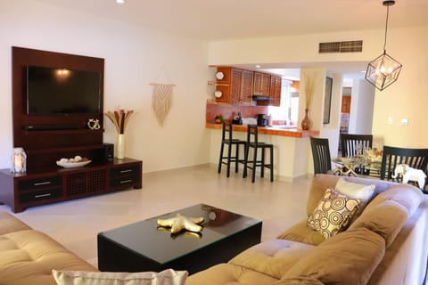Sofa with view of TV, Dining & Kitchen 