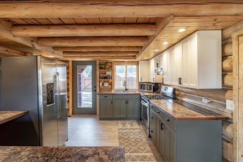 Stocked with pots/pans/griddle/utensils/ dinnerware, & papergoods.