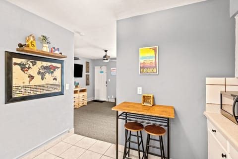 Boutique Beach Retreat Treasure Island full kitchen, stove refrigerator, freezer, microwave, coffee maker, kitchen utensils and flatware kitchen table