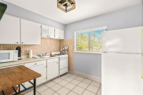 Boutique Beach Retreat kitchenette, microwave, stove/oven, refrigerator/freezer, coffee maker, kitchen basics, table and chairs