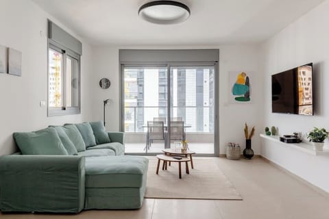 Bright living room designed for relaxation, offering spacious comfort praised by visitors returning for another stay.