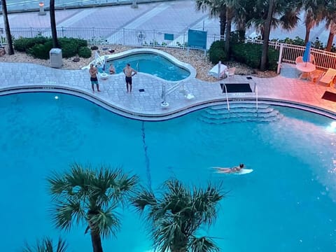 Hot tubs are spotted around the various pools