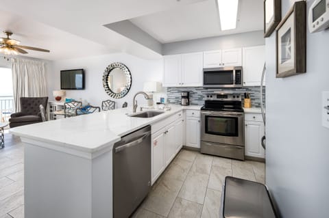 Kitchen - The kitchen in well stocked & has stainless steel appliances for your cooking needs.