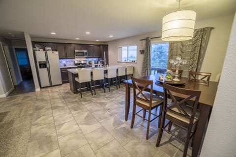 Modern kitchen with granite countertops and oversized island.