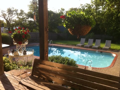 Back yard fenced in swimming pool.  This pool does have a deep end.  