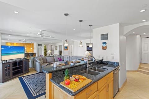 View of the living room from the kitchen. View with back to the cabinetry. 