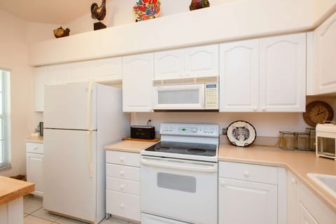 Fully stocked kitchen...refrigerator w/ ice maker, dishwasher, oven/stove, microwave, coffee pot, toaster and toaster oven.