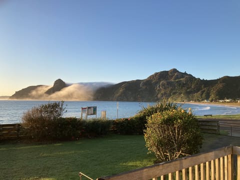 Mist rolling over the headland from Whangaroa Harbour- taken from the deck