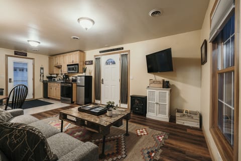 Bright living/dining area with views of downtown Fish Creek