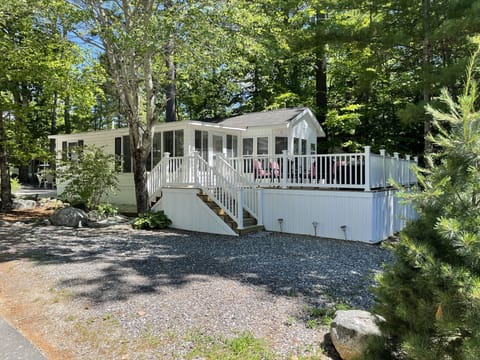 Full deck with patio seating, patio table and grill