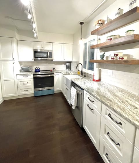 Kitchen amenities include coffee maker, toaster, microwave and tea kettle 