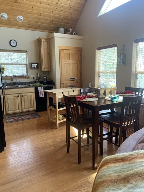 Kitchen. Shows dining table that seats 6.