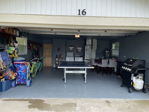 Garage w/ ping pong table, outdoor gas grill, seating for 5 at high top table