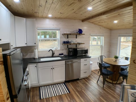 Stainless steel appliances and granite countertops. Dining nook seats 4.