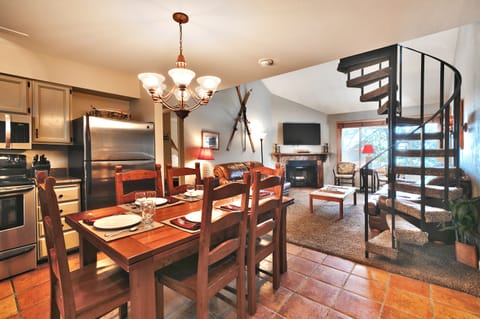 Dining are has a rectangle dining table and seating for six with high back chairs