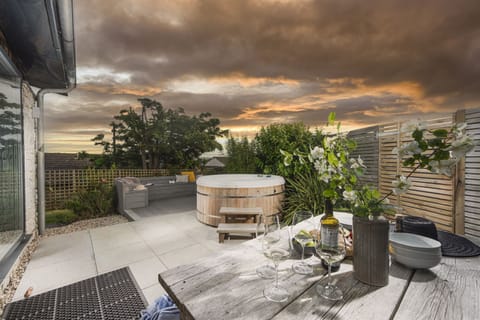 Dusk shot of the patio and hot tub - 6 The Dunes, Upton Towans