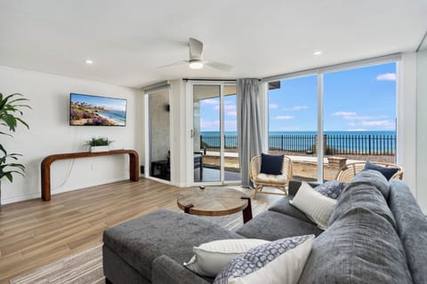 Bright remodeled living room with sweeping ocean views