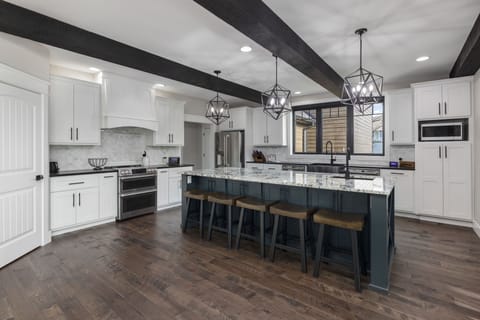 Expansive, fully stocked kitchen.