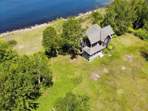 Aerial view of the home and waterfront