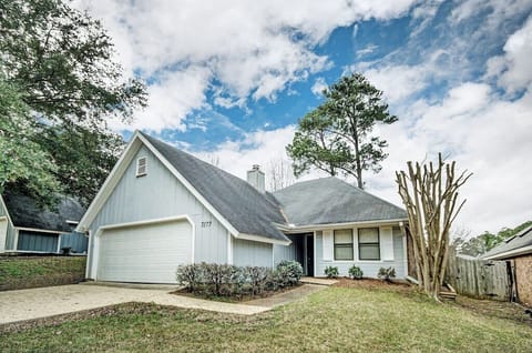 The front of the house with a garage and driveway.