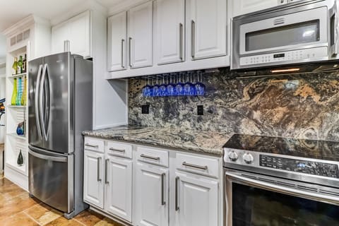 Flattop stove and side by side fridge.
